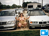 Watch her big melons hiding between cars outdoors