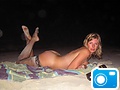 Janet McDougall naked on the beach in stockings
