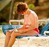 topless woman reading on the beach-1535r025t_155.jpg